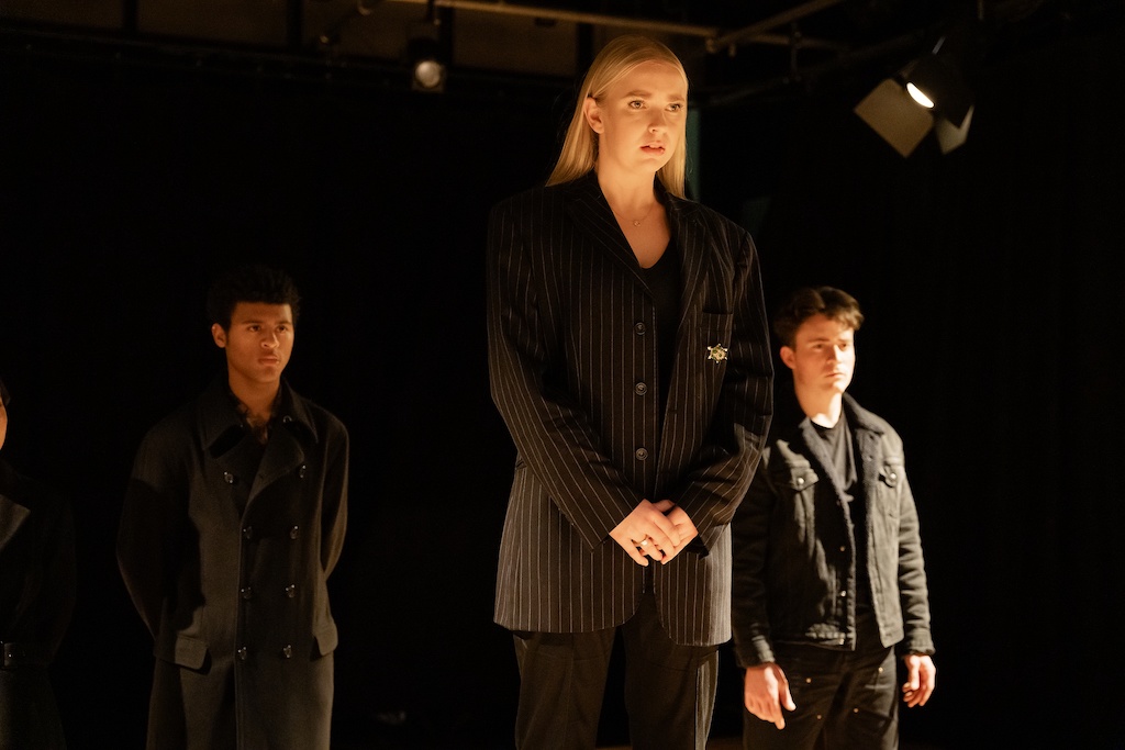 Three actors stand on stage during the final presentation of The Winter's Tale Three actors stand on stage during the final presentation of The Winter's Tale.